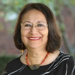 Elvira de Mejia, Ph. D. Woman, Elvira de Mejia, Ph. D., portrait with trees in the background
